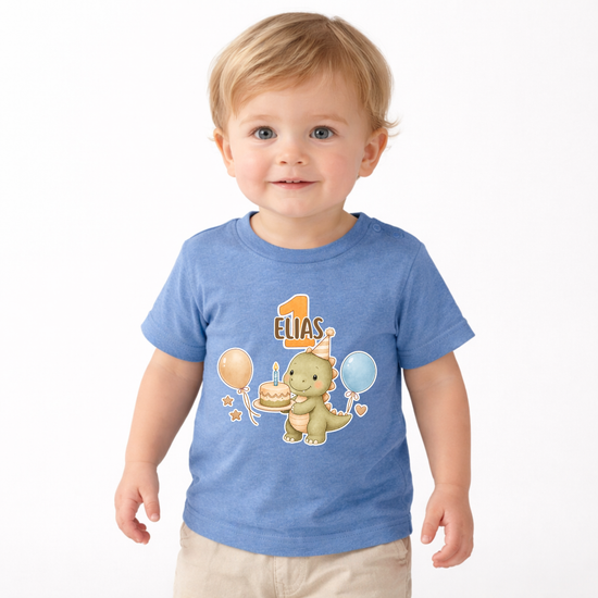 Blaues Baby T-Shirt mit personalisiertem Namen Elias und Dino Geburtstagsmotiv, ideal als Geschenk zum ersten Geburtstag mit Ballons und Torte