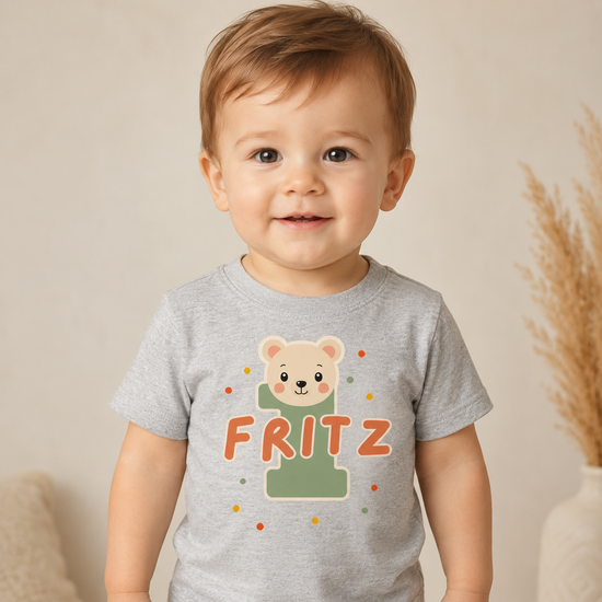 Graues Babyshirt 1. Geburtstag mit Bär, personalisiertem Namen Fritz und bunten Punkten